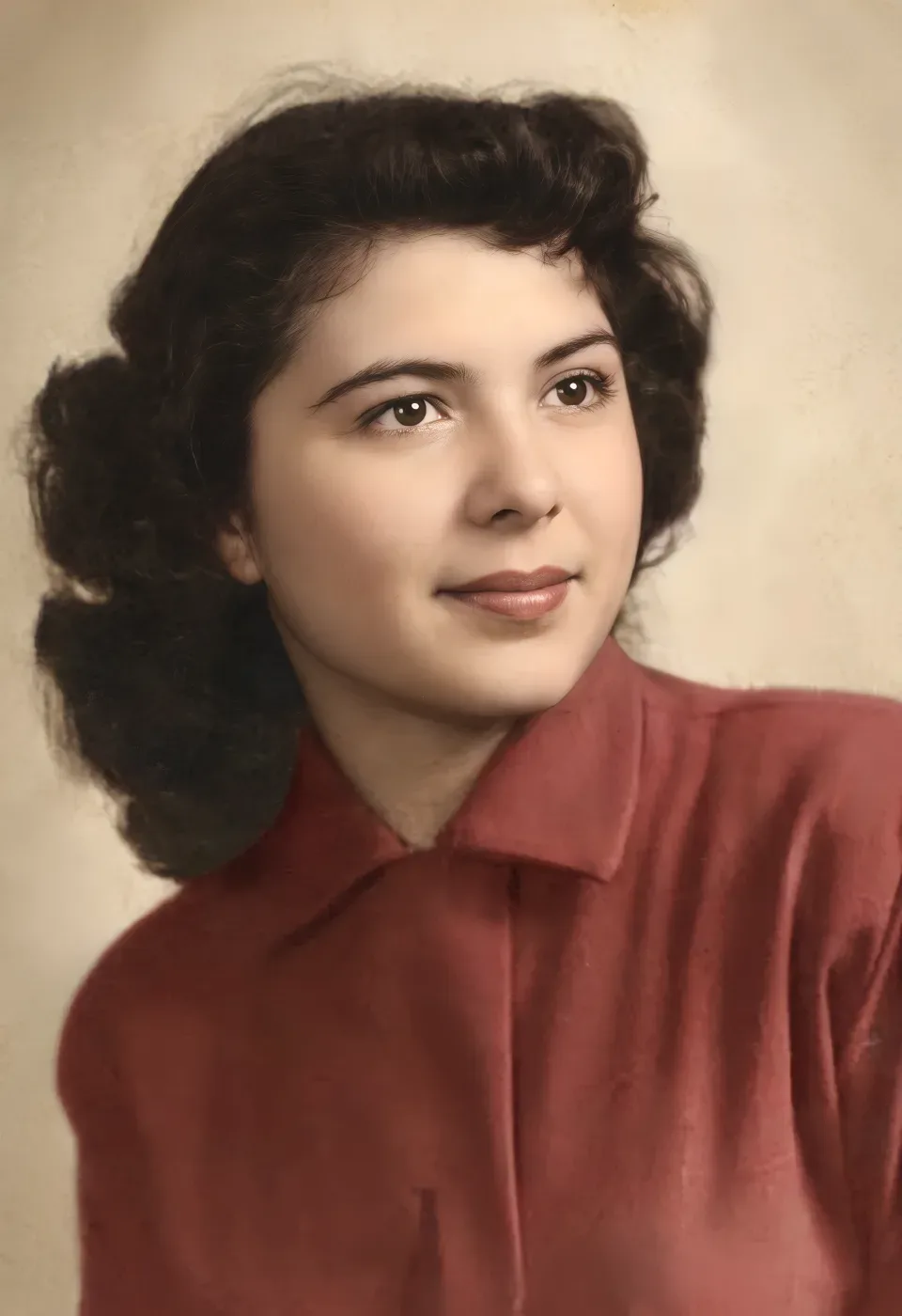 A creased 1950s studio portrait of a young woman, restored and colorized